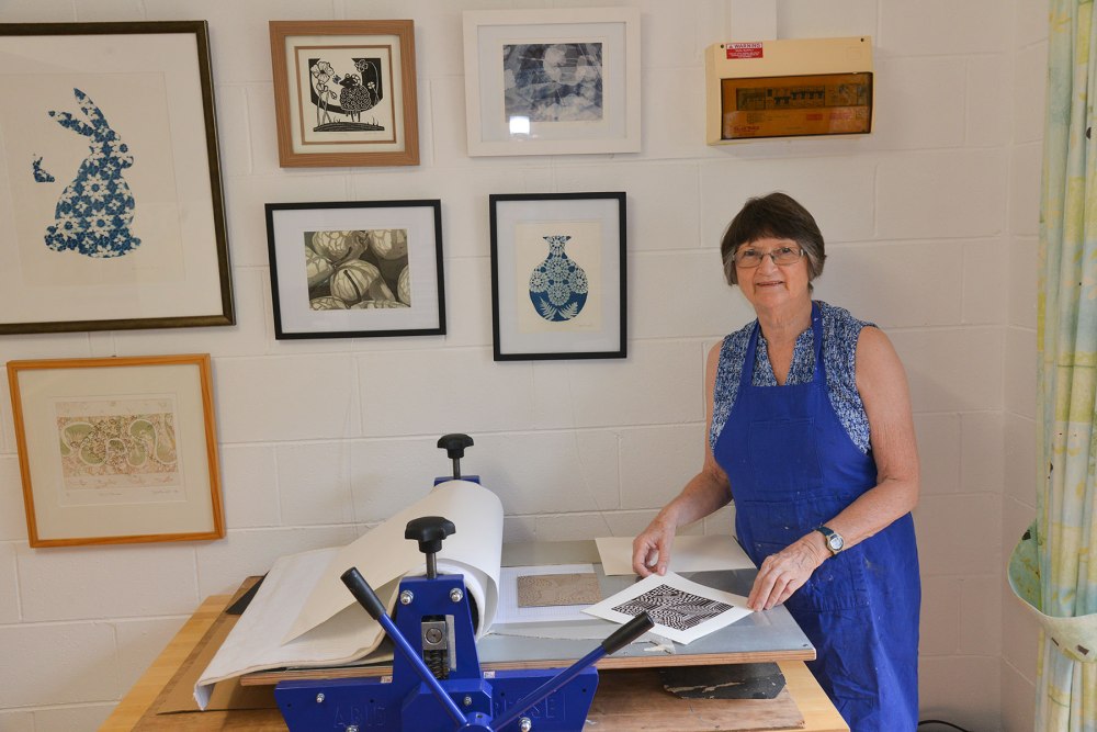 Jennifer in her studio at Mapleton with her ABIG printing press.